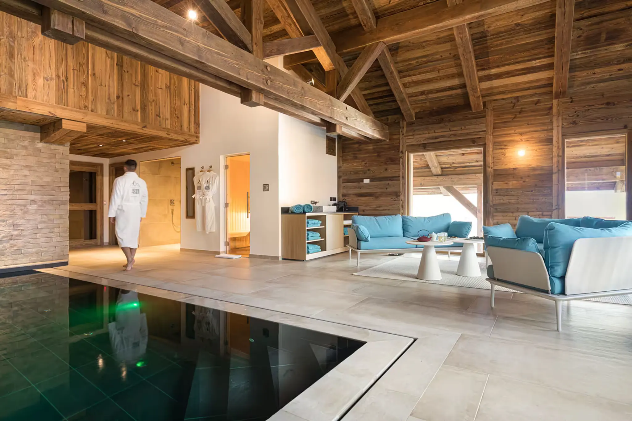 The supplied chalet spa with an indoor pool, sauna and relaxation seating.