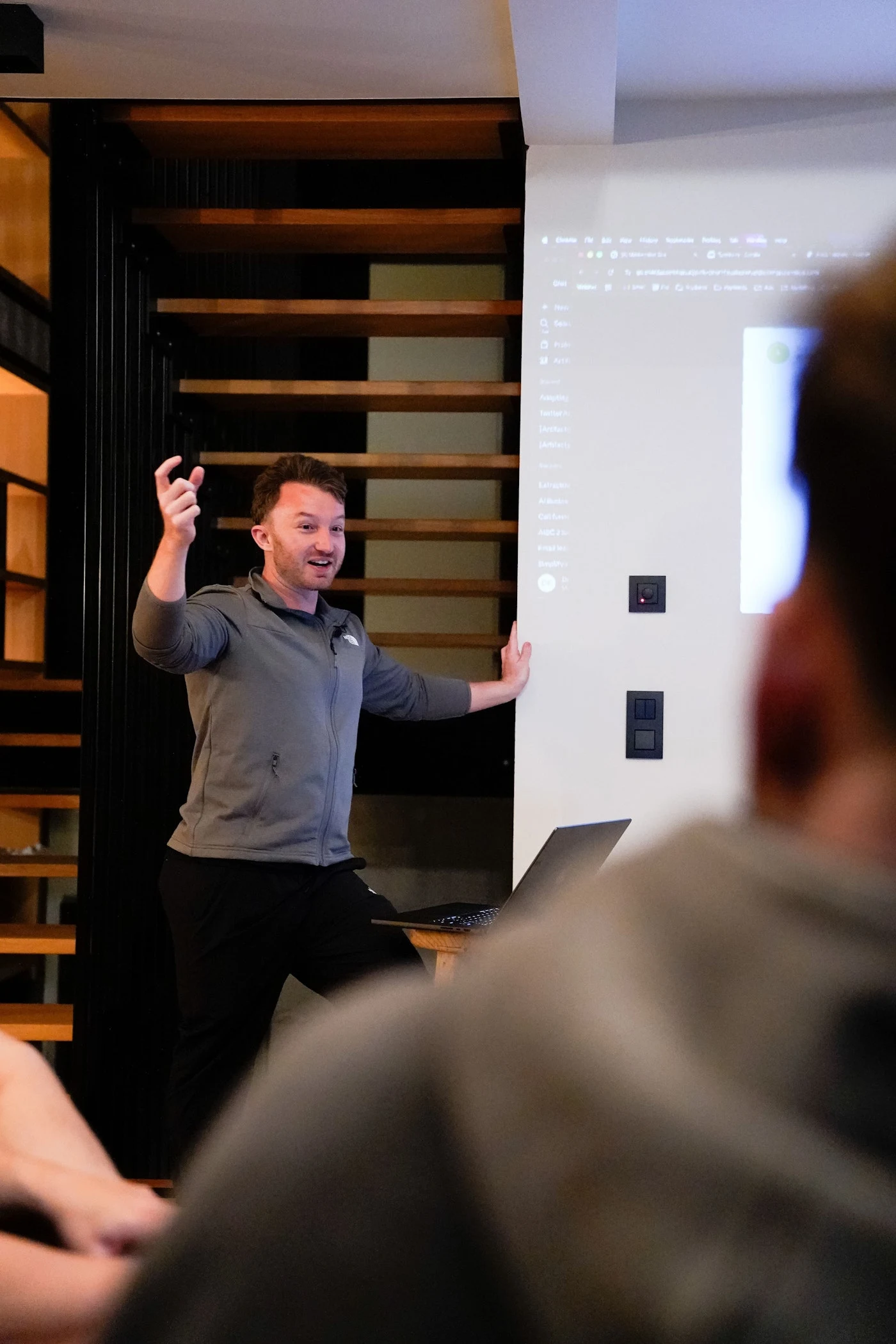 An entrepreneur presenting to the group during a 2026 mastermind session.