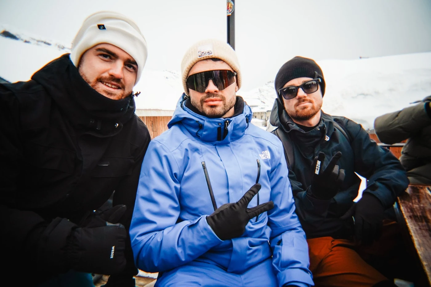 Three members of the 2026 group together at après-ski.