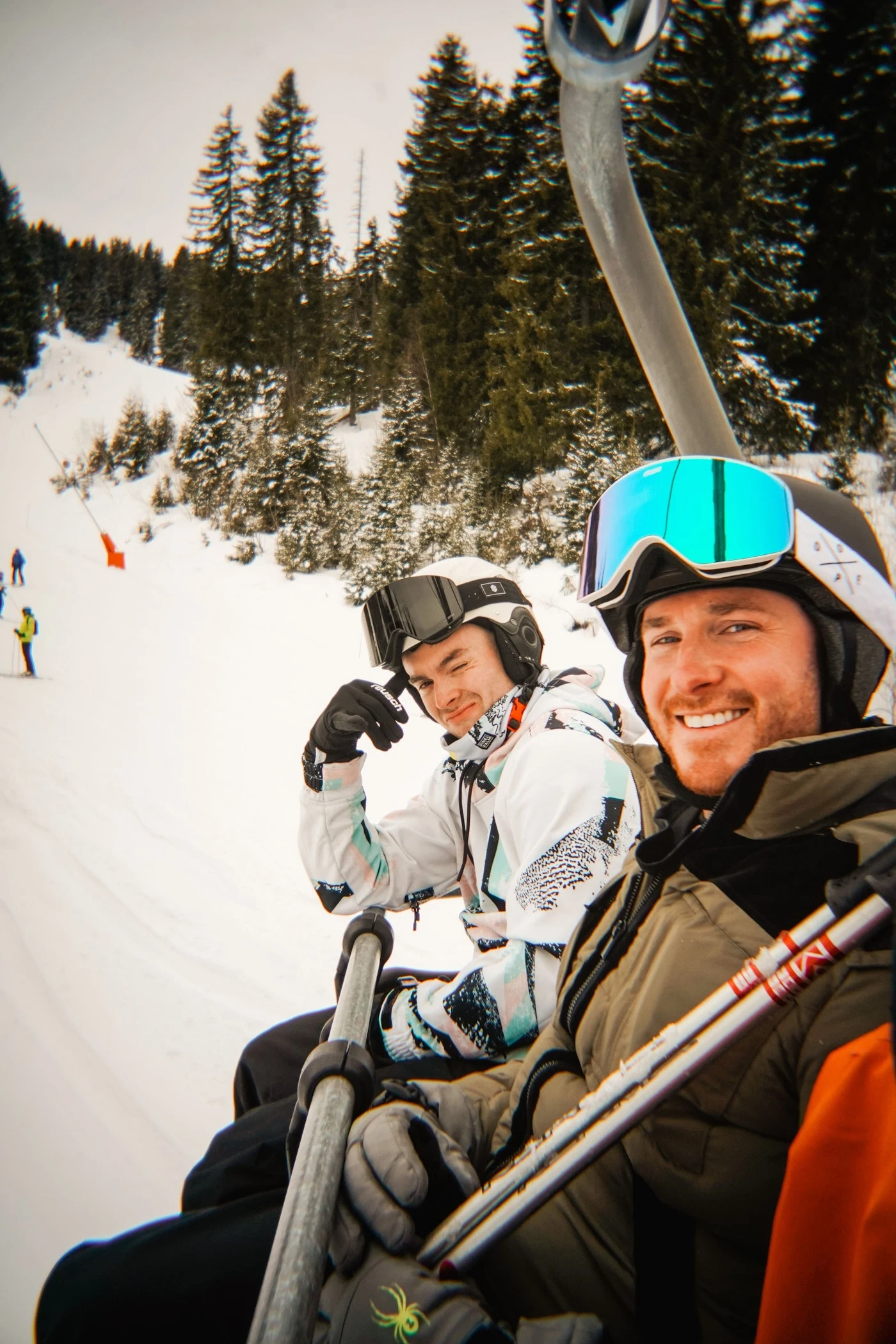 Members of the 2026 group together on a ski lift.